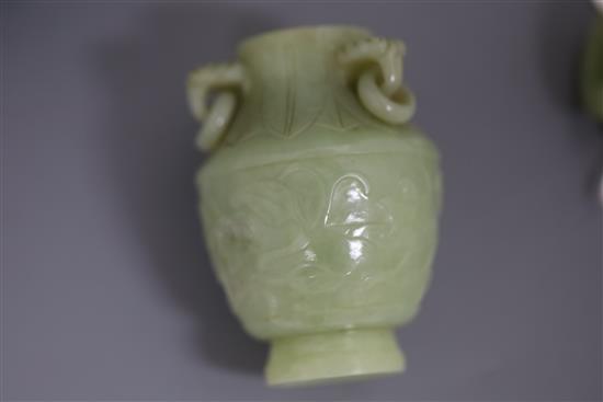 A pair of Chinese carved jade vases and covers, height 12cm